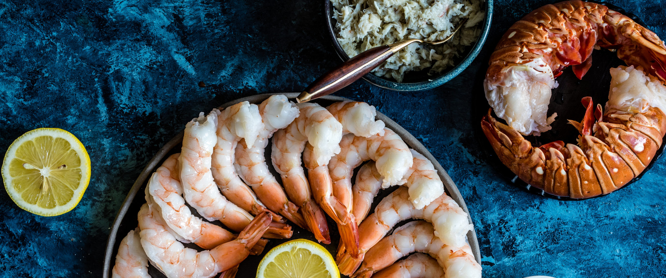shrimp platter and lobster tails with lemon and cocktail sauce